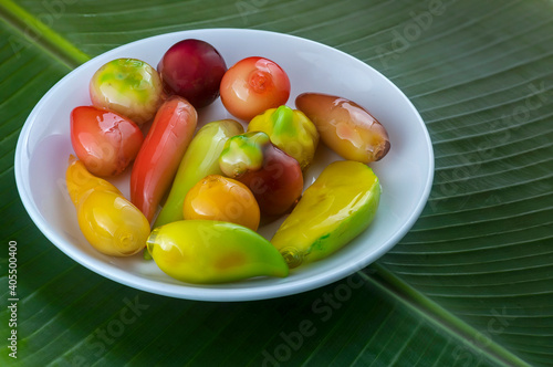 Look choop, also spelled look choop, is a Thai dessert that comes from a Portuguese marzipan recipe called massapao. In Thai, green beans are used as the main ingredient in this type of cooking