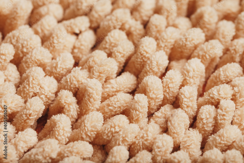 The structure of beige wool fibers in full screen as a background. The structure of beige wool fibers in full screen as a background.