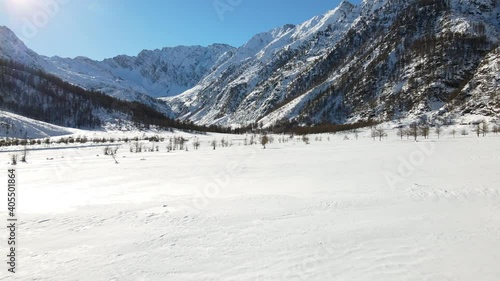 Wallpaper Mural Daylight drone flight in mountain landscape with snow. Alps, Italy. Aerial video footage. Torontodigital.ca