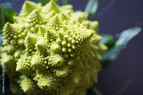 Close up with a romanescu coliflower with a black background photo