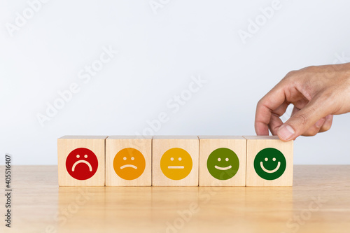 Customer choose smile face emoticon. Service rating, feedback, satisfaction concept