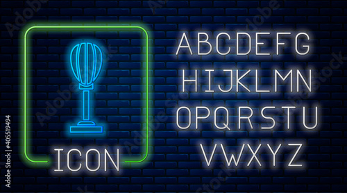 Glowing neon Punching bag icon isolated on brick wall background. Neon light alphabet. Vector.
