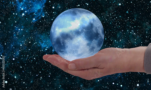 hold up the moon with a starry sky on the palm of your hand