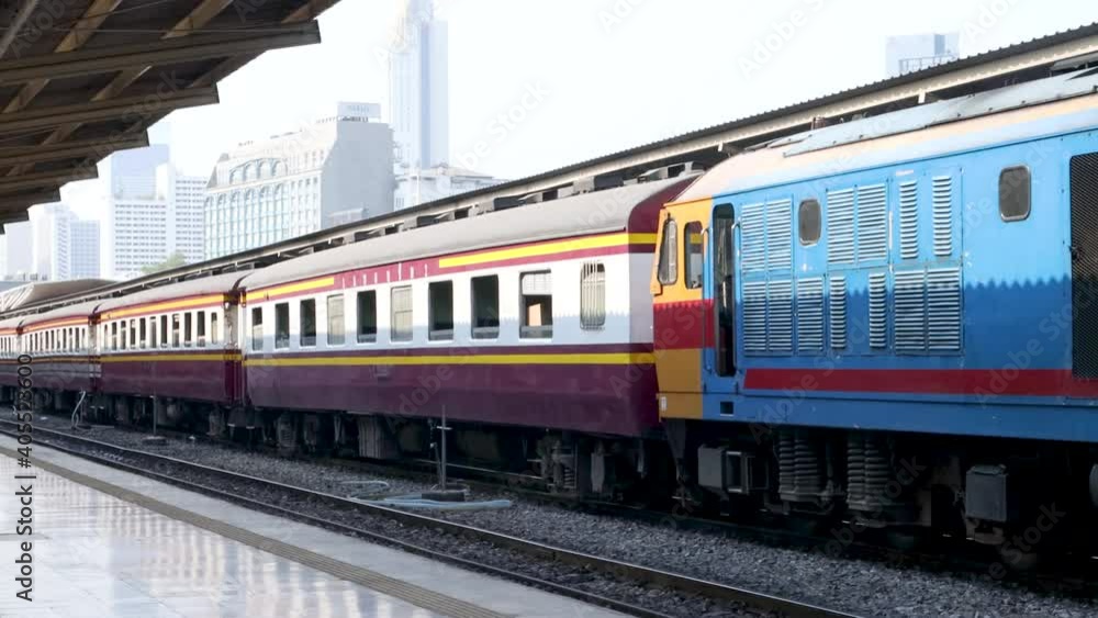 diesel train is crossing in Railway station. railway station in Bangkok to travel across the country. Rail transport to transport people. diesel train is crossing in Railway station. railway station in Bangkok to travel across the country. Rail transport to transport people.