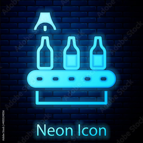 Glowing neon Brewery factory production line pouring alcoholic drink in glass bottles icon isolated on brick wall background. Vector.