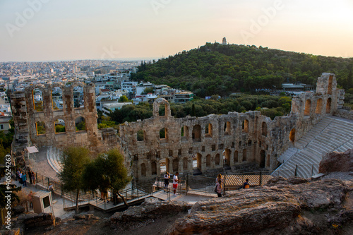 The Odeon of Herodes Atticus ( Herodeion) is a stone Roman theater structure located on the southwest slope of the Acropolis of Athens, Greece. sunset time photo