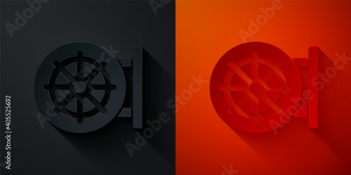 Paper cut Dharma wheel icon isolated on black and red background. Buddhism religion sign. Dharmachakra symbol. Paper art style. Vector.