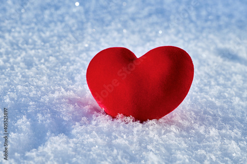 A red hot heart lies on the cold snow