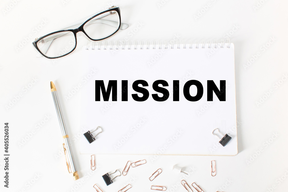 Notepad with inscriptions MISSION on a white background. business concept. Notepad with inscriptions MISSION on a white background. business concept.