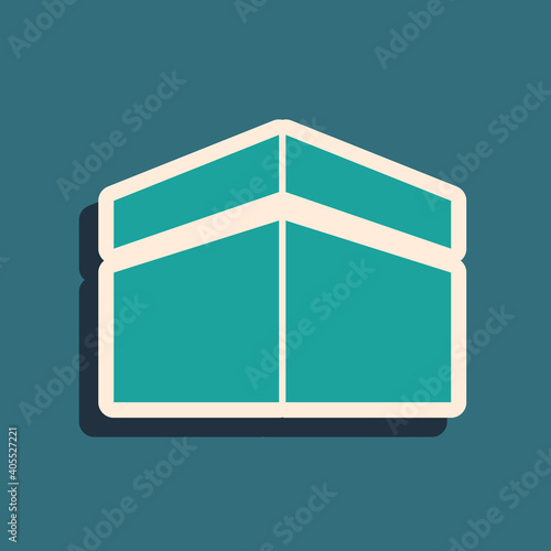 Green Kaaba mosque icon isolated on green background. Kaaba hajj Mecca pray pilgrimage Ramadan Islam muslim mosque. Long shadow style. Vector.