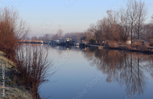 View of the picturesque River Dender, at Gijzegem near Aalst in East Flanders, Belgium, on a cold winters morning. © Imladris