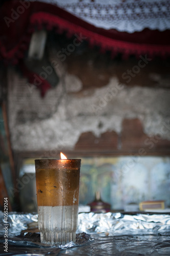 Fototapeta Naklejka Na Ścianę i Meble -  Candle lights with flames glowing in oil in church.