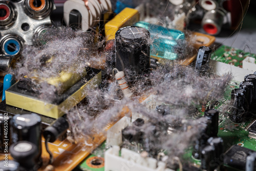 Tableau sur toile Very dusty old circuit board of electronic device illustrating concept of planne
