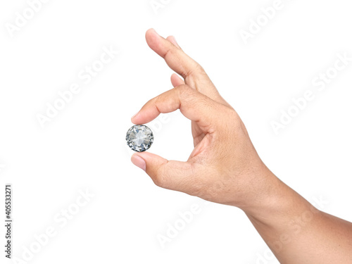 Hand holding diamond isolated on white background