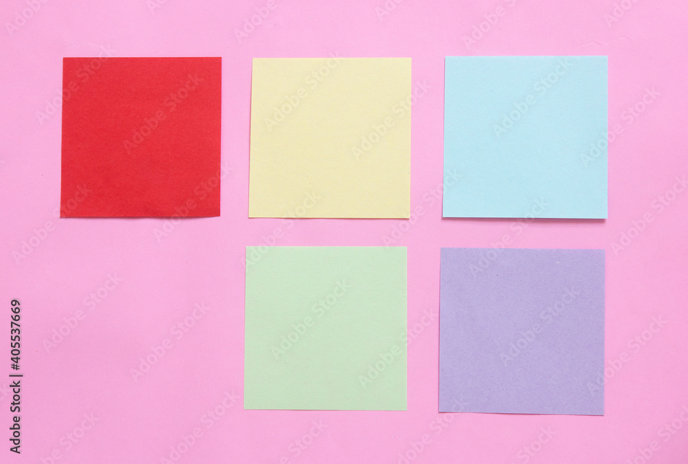 multicolor of sticky note paper on pink background