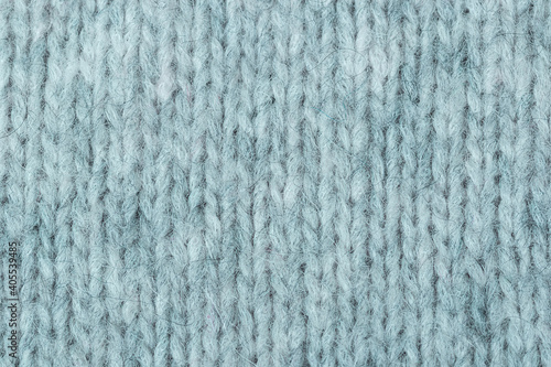 knitted wool texture. Light gray background close up . Hobby concept