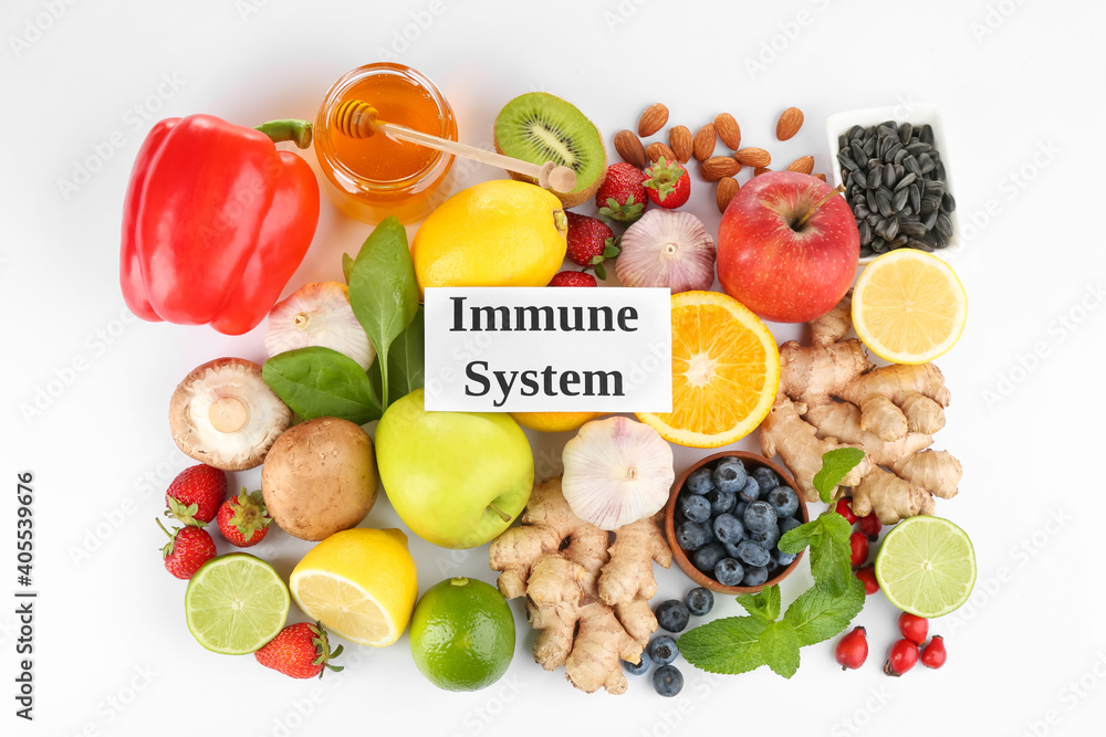 Set of natural products and card with text Immune System on white background, top view Set of natural products and card with text Immune System on white background, top view