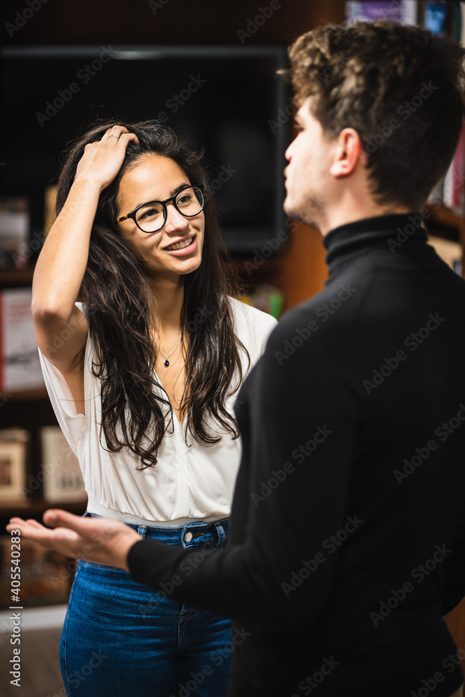 Ethnic woman speaking with male colleague