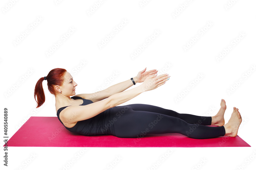 Pilates or yoga. A slender athletic girl performs an exercise on the mat to bend the spine, neck and chest. Wellness exercises to strengthen the cortex muscles. Isolated on a white background Pilates or yoga. A slender athletic girl performs an exercise on the mat to bend the spine, neck and chest. Wellness exercises to strengthen the cortex muscles. Isolated on a white background