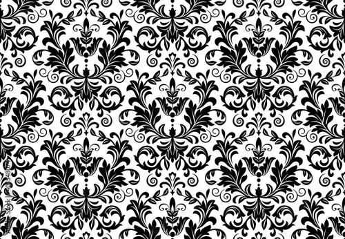 Wallpaper in the style of Baroque. Seamless vector background. White and black floral ornament. Graphic pattern for fabric, wallpaper, packaging. Ornate Damask flower ornament