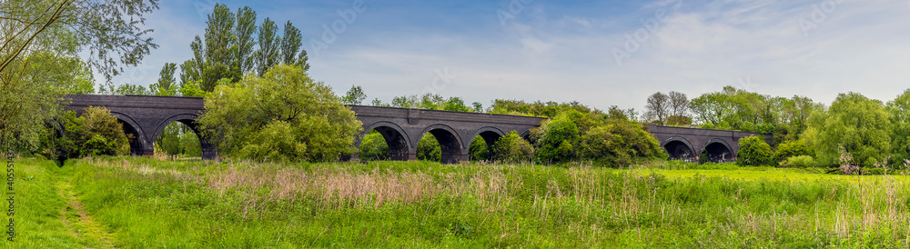 A panorama view across the old railway viaduct at Thrapston, UK in springtime