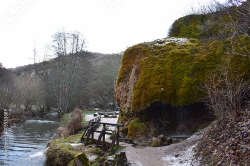 bunter Wasserfall Dreimühlen bei Nohn in der Eifel während des Winters photo