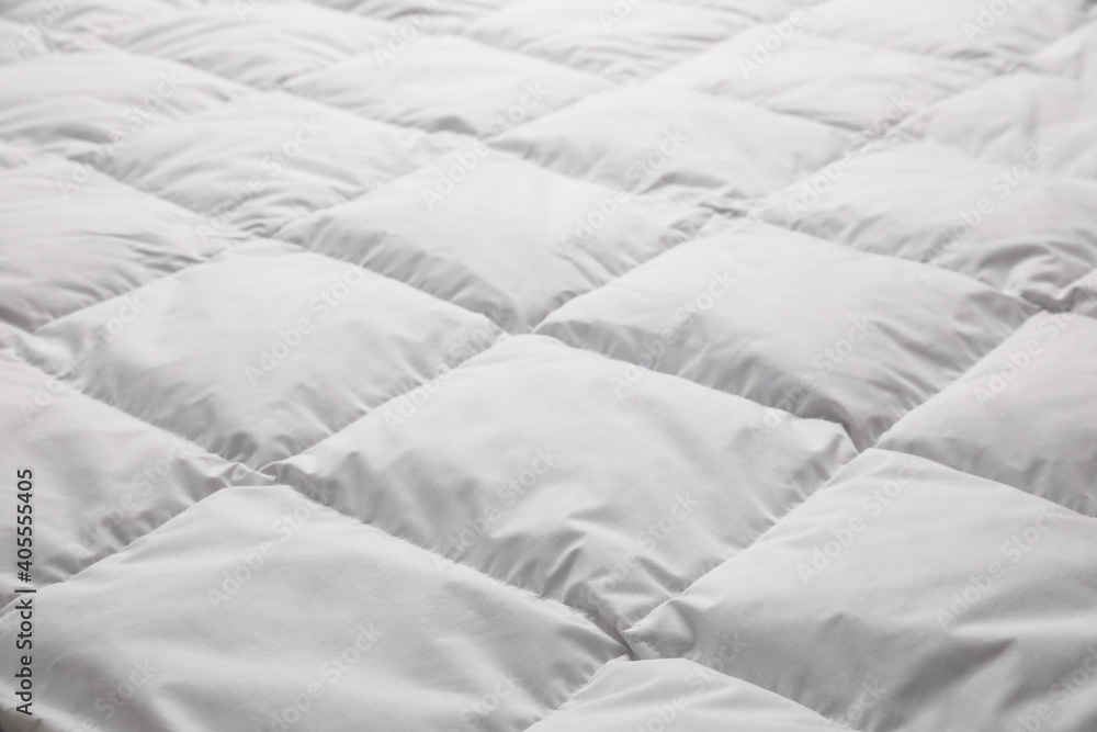 Obraz premium Soft quilted blanket as background, closeup view