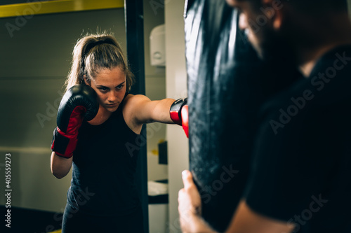 young woman has boxing training