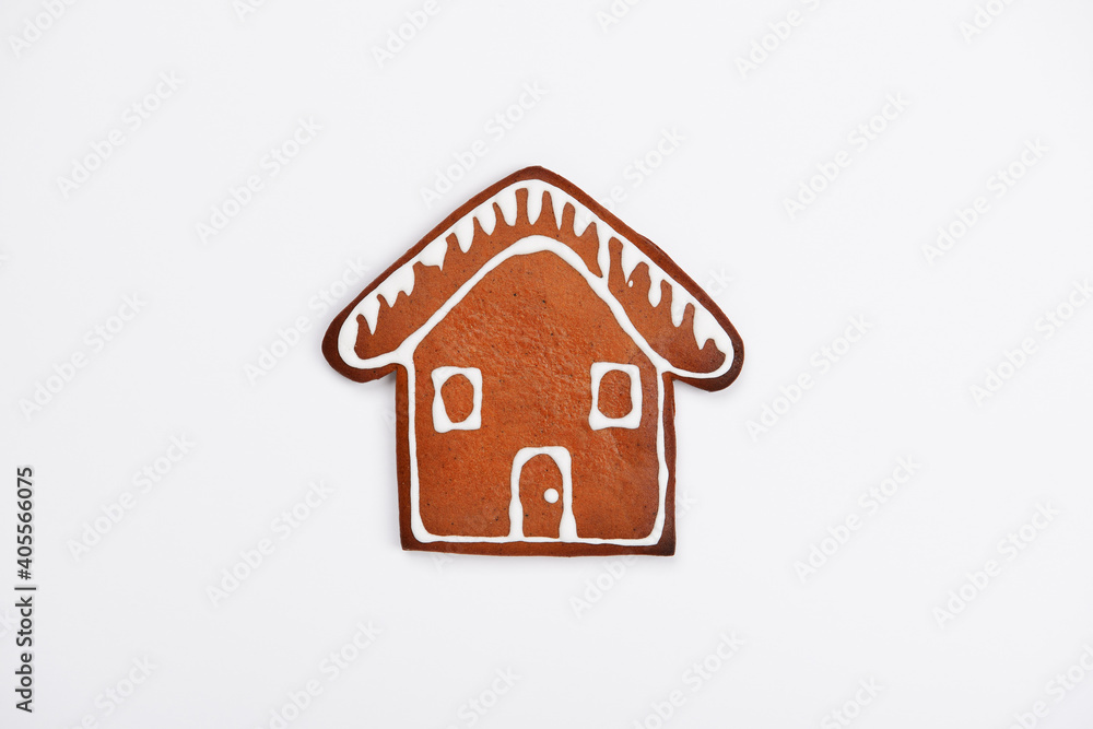 The hand-made eatable gingerbread house on white background