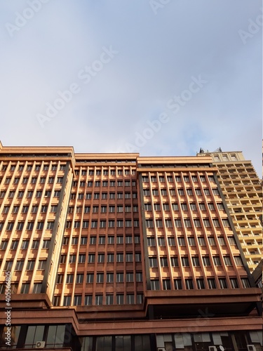 Genova, Italy - January 14, 2021: Modern construction in the city center of Genova, beautiful high skylines with grey and blue sky in the background in winter.