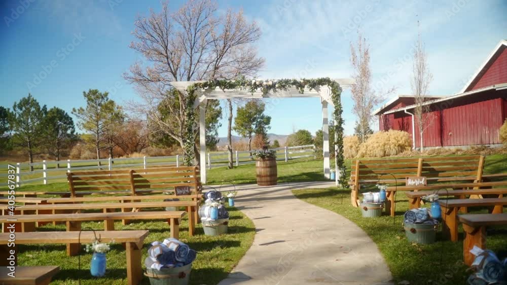WS Wide shot of wedding arch and benches WS Wide shot of wedding arch and benches