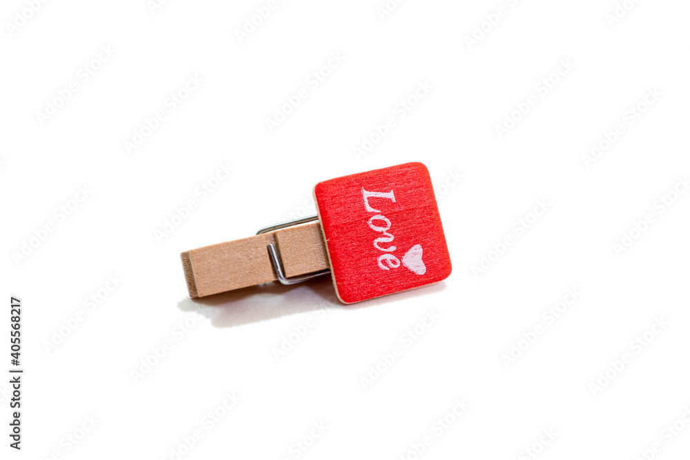 Mini wooden clothespin with love word on white backgorund. Valentine day concept. Mini wooden clothespin with love word on white backgorund. Valentine day concept.