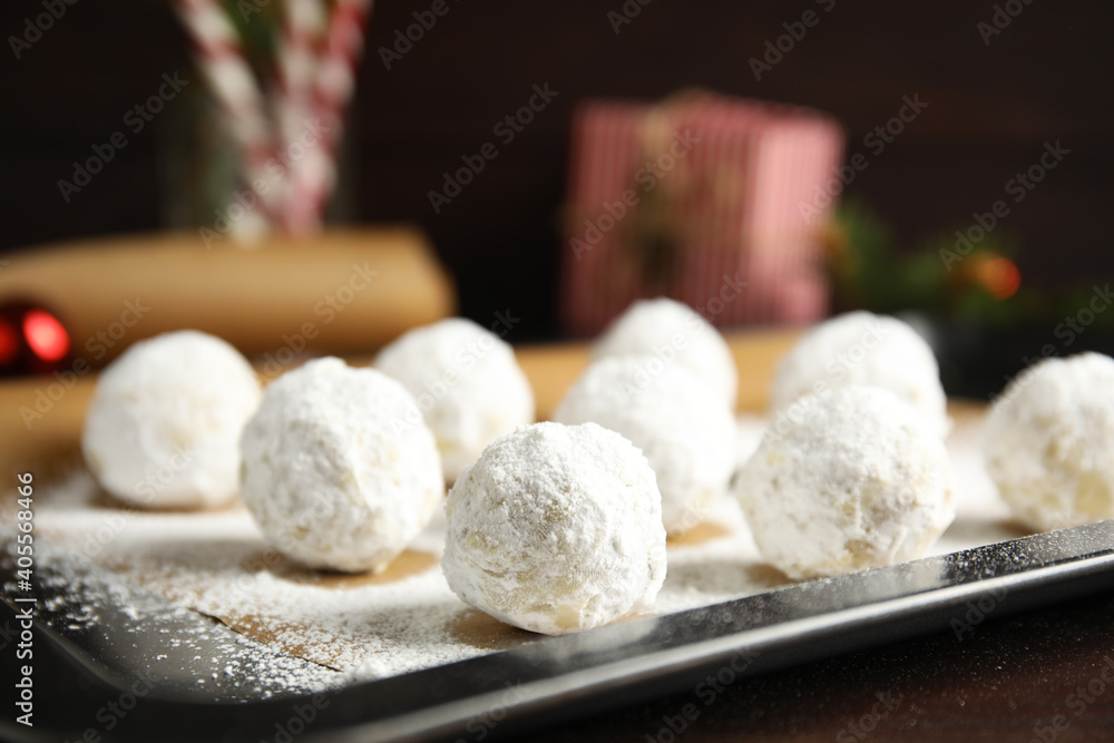 Christmas snowball cookies on baking tray, closeup