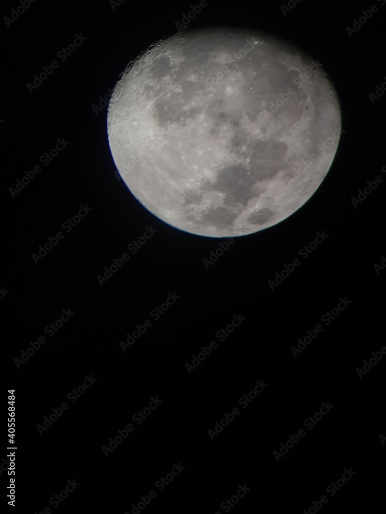 Almost full moon lights up in the dark night Almost full moon lights up in the dark night