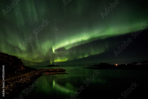 Reflections of aurora over water