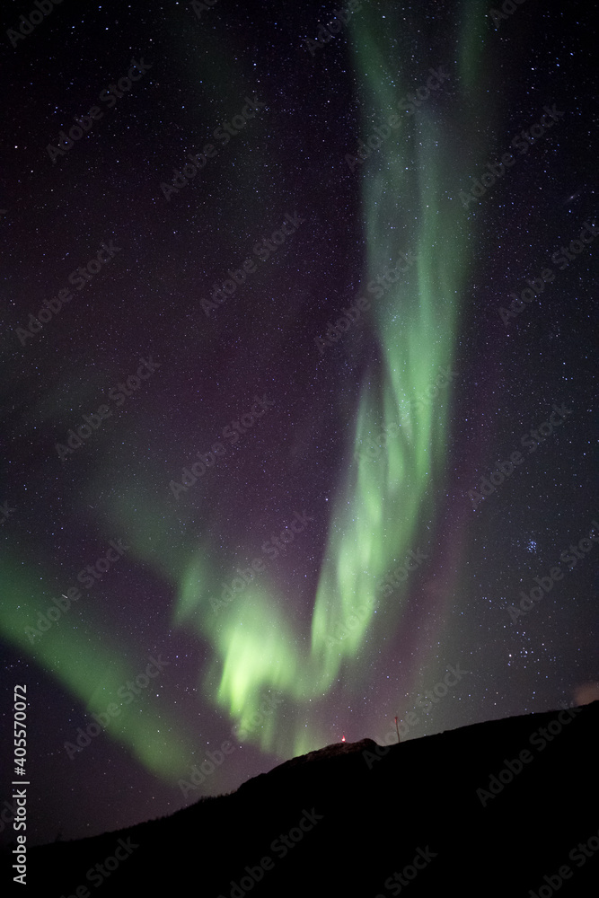 Auroras rising up in reds and green