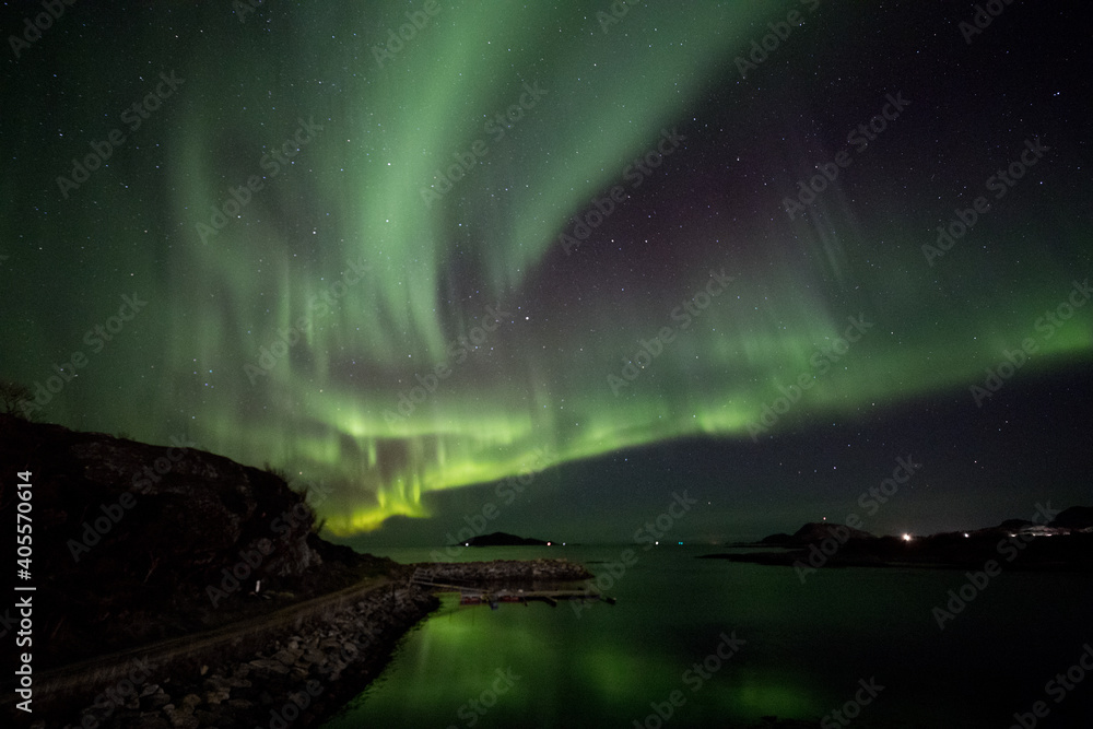 Aurora over mountains and water