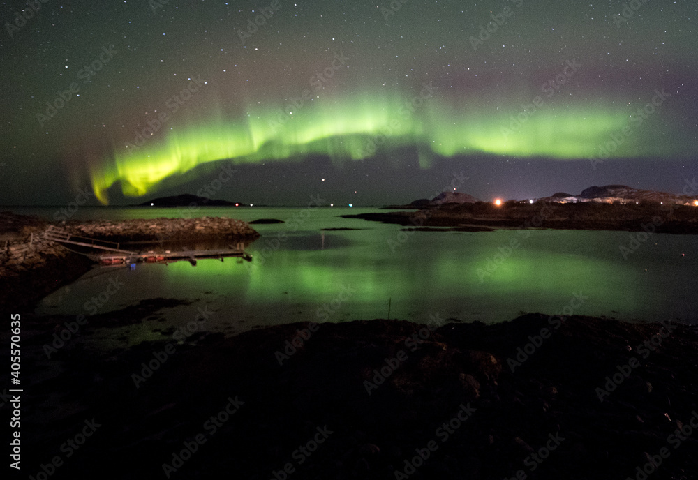 Aurora reflections across the fjord