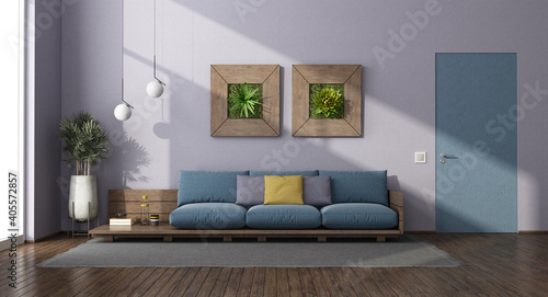 Modern living room with wooden sofa with blue cushion