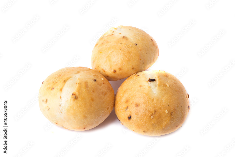 Round wheat buns with linseeds and sesame seeds isolated on white Round wheat buns with linseeds and sesame seeds isolated on white