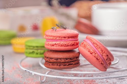 Colorful macarons over on grey background. photo