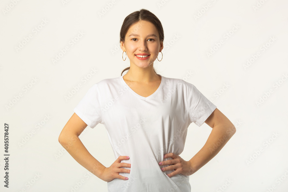 beautiful young woman in white t-shirt on a white background beautiful young woman in white t-shirt on a white background