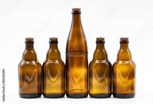 A row of empty brown bottles