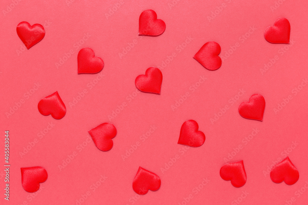 A pattern of romantic hearts on a red background. Confetti. The texture of Valentine's Day. The concept of love