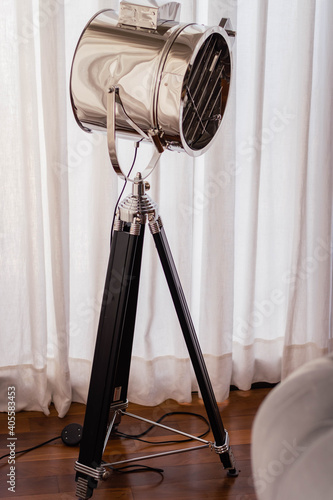 light reflector on tripod with director type decoration light with white curtain background cordoba argentina photo