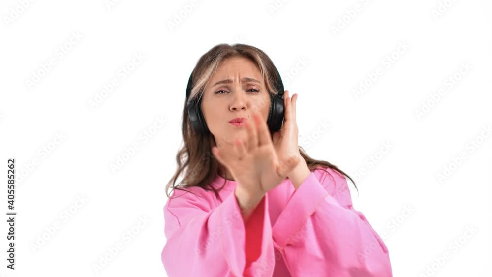 Portrait of funny feminine enjoying audio sound in headphones. Shot on RED Raven 4k Cinema Camera Portrait of funny feminine enjoying audio sound in headphones. Shot on RED Raven 4k Cinema Camera