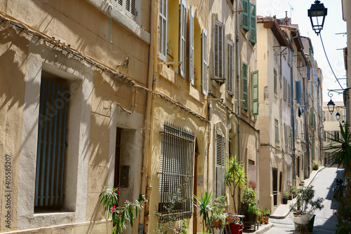  Narrow street with old houses in Marseille, France