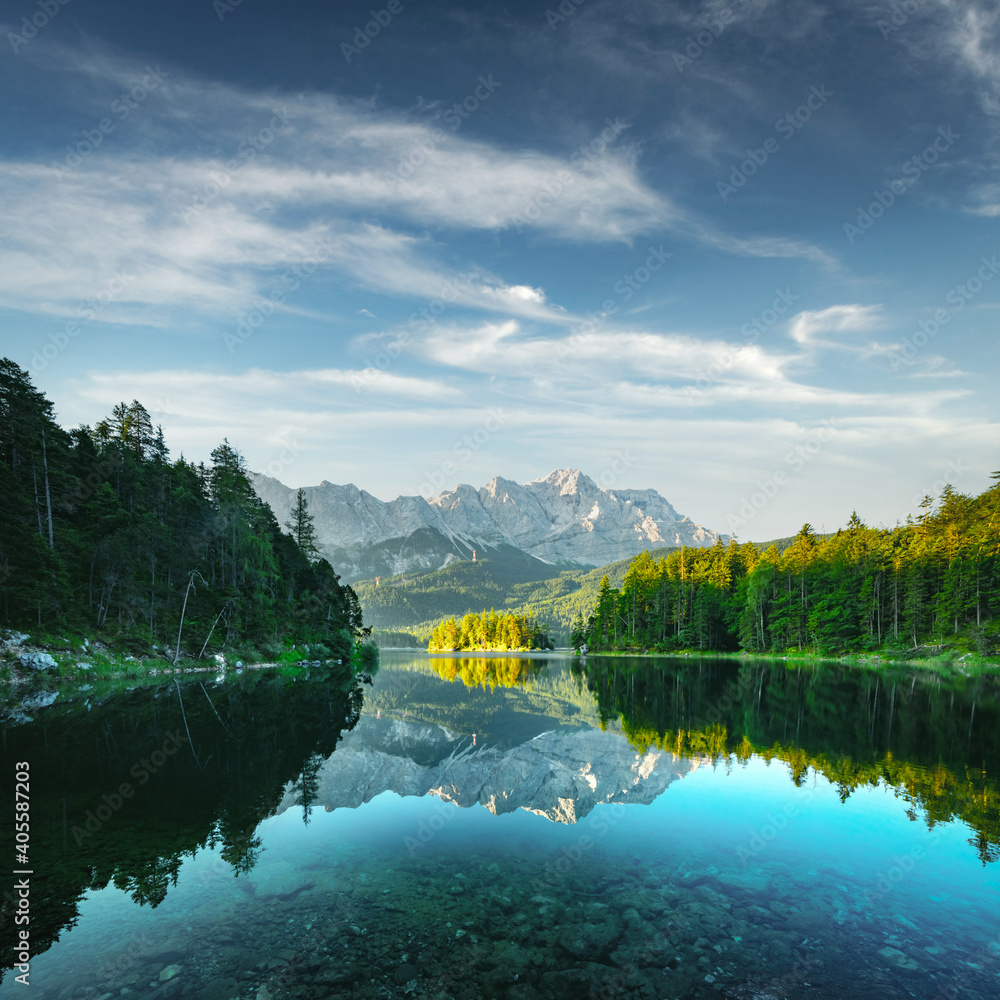 Naklejka premium Fantastic view on mountain lake Eibsee, located in the Bavaria, Germany. Dramatic unusual scene. Alps, Europe. Landscape photography