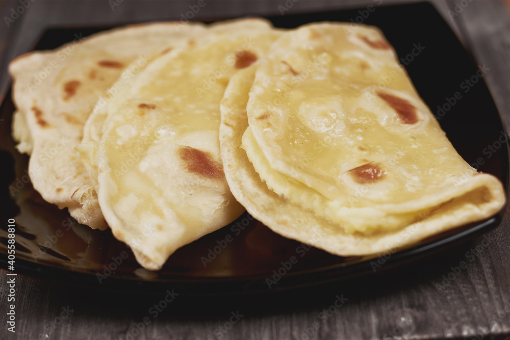 national tatar cuisine kystyby on a plate. potatoes in unleavened dough