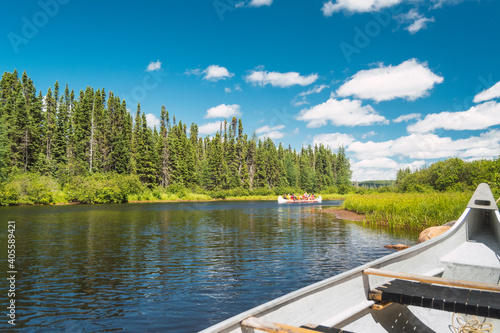 Foto Canoe floating on Lake in a forest of Canada